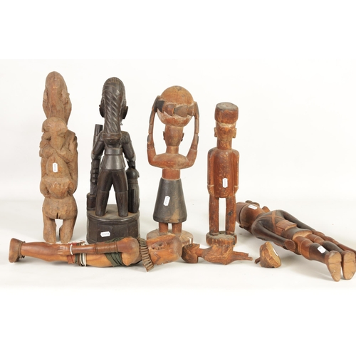 204 - A SELECTION OF SEVEN CARVED AFRICAN FIGURES of various size and design (50cm high and smaller )