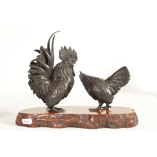 209 - A JAPANESE MEIJI PATINATED BRONZE SCULPTURE ON HARDWOOD BASE finely modelled as a cockerel and hen s... 