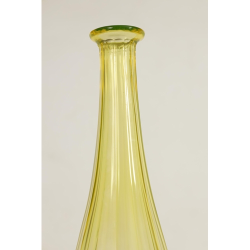 21 - A PAIR OF BOHEMIAN PALE AMBER WINE BOTTLES with faceted tapered slender necks and lower bodies enclo... 