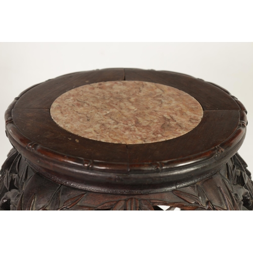 210 - A SMALL 19TH CENTURY CHINESE CARVED HARDWOOD JARDINIERE STAND the pink circular marble inset top abo... 