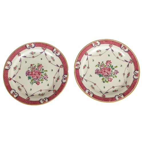 212 - A PAIR OF 18TH/19TH CENTURY CHINESE FAMILLE ROSE PLATES painted in vibrant coloured enamels with flo... 