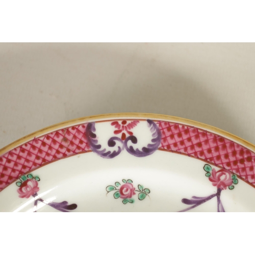 212 - A PAIR OF 18TH/19TH CENTURY CHINESE FAMILLE ROSE PLATES painted in vibrant coloured enamels with flo... 