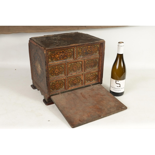 216 - A 17TH CENTURY ANGLO INDIAN TABLE CABINET with scroll and portrait decorated painted body; the hinge... 