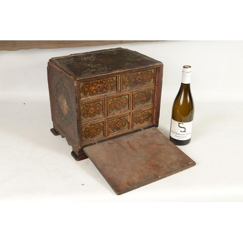 216 - A 17TH CENTURY ANGLO INDIAN TABLE CABINET with scroll and portrait decorated painted body; the hinge... 