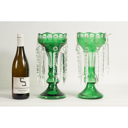 22 - A PAIR OF 19TH CENTURY GREEN AND CLEAR GLASS LUSTRES with facet cut tapering bodies and angled dropp... 