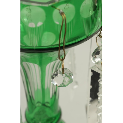 22 - A PAIR OF 19TH CENTURY GREEN AND CLEAR GLASS LUSTRES with facet cut tapering bodies and angled dropp... 