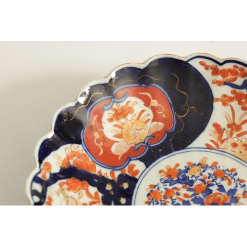 221 - TWO 19TH CENTURY JAPANESE IMARI PORCELAIN CHARGERS of floral panelled design with scalloped edges (2... 