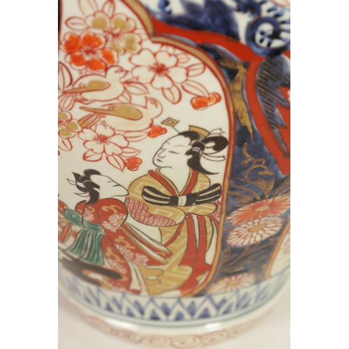 226 - A 19TH CENTURY JAPANESE LARGE INVERTED BALUSTER VASE AND COVER with colourful panelled floral and fl... 