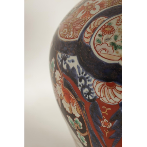 226 - A 19TH CENTURY JAPANESE LARGE INVERTED BALUSTER VASE AND COVER with colourful panelled floral and fl... 