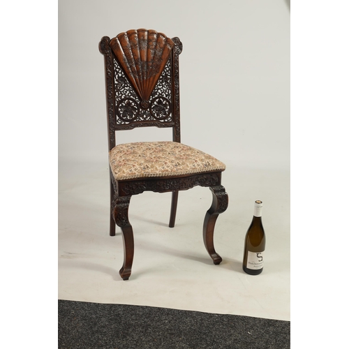 227 - A LATE 19TH CENTURY CHINESE HARDWOOD SINGLE CHAIR with fan shaped and pierced work back above an uph... 