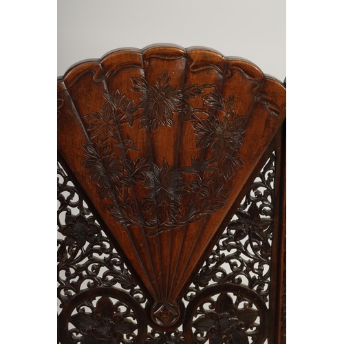 227 - A LATE 19TH CENTURY CHINESE HARDWOOD SINGLE CHAIR with fan shaped and pierced work back above an uph... 