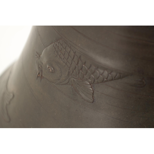 228 - A LARGE JAPANESE MEIJI PERIOD BRONZE VASE DECORATED WITH CARP of flared tapering shape with swimming... 