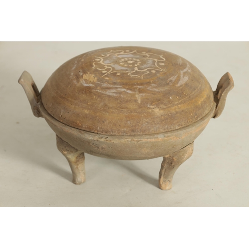 230 - A CHINESE TANG PERIOD THREE LEGGED POT AND COVER the domed lid with painted flowerhead on a two hand... 