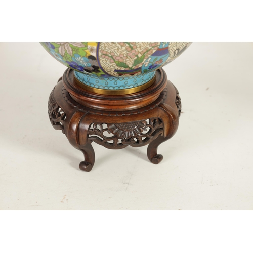 234 - A LATE 19TH CENTURY CHINESE CLOISONNÉ ENAMEL JAR AND COVER ON CARVED WOOD STAND of tapering shoulder... 