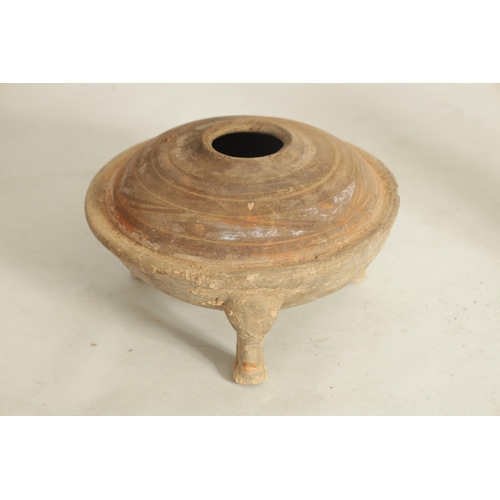 238 - A CHINESE HAN PERIOD THREE LEGGED POT with domed top raised on three cabriolet legs (13.5cm high, 22... 