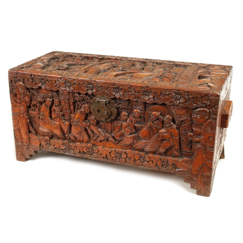 239 - AN EARLY 20TH CENTURY CHINESE CARVED HARDWOOD BLANKET BOX with carved figural landscape panels to th... 