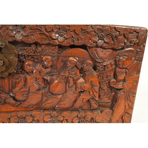 239 - AN EARLY 20TH CENTURY CHINESE CARVED HARDWOOD BLANKET BOX with carved figural landscape panels to th... 