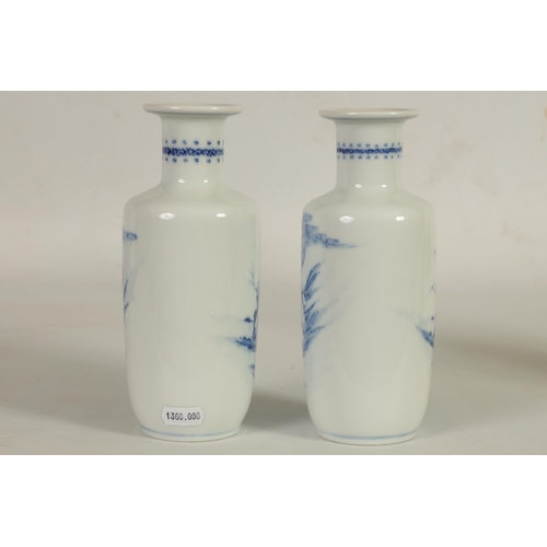 240 - A PAIR OF 19TH CENTURY CHINESE BLUE AND WHITE ROULEAU PORCELAIN VASES the bodies decorated with figu... 