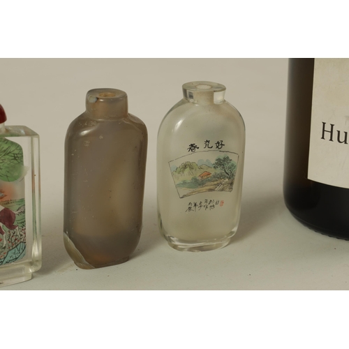 243 - A COLLECTION OF FIVE CHINESE SNUFF BOTTLES comprising of two reverse painted glass bottles, one jade... 