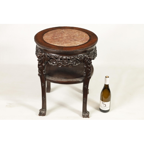 244 - A 19TH CENTURY PROFUSELY CARVED CHINESE HARDWOOD CIRCULAR JARDINIERE STAND with marble inset top and... 