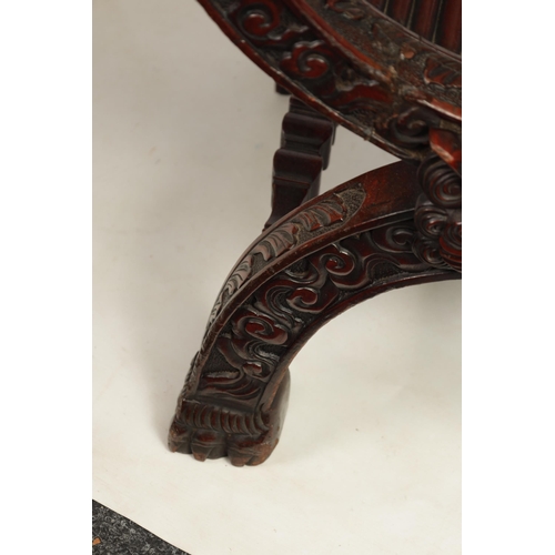 257 - AN IMPRESSIVE LATE 19TH CENTURY CHINESE HARDWOOD X FRAME THRONE CHAIR profusely carved with a panell... 