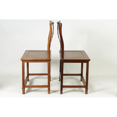 264 - A PAIR OF 19TH CENTURY CHINESE HARDWOOD HALL CHAIRS with vase-shaped solid centre splats within a ro... 