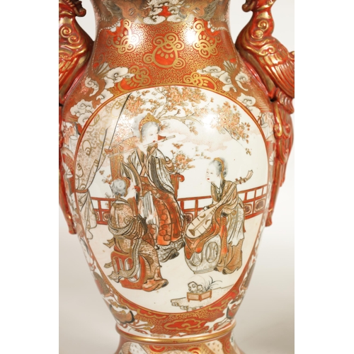 266 - A LARGE PAIR OF JAPANESE MEIJI PERIOD KUTANI LIDDED VASES with panels of figures in garden settings ... 