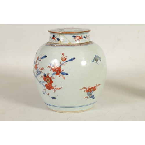 270 - A 18TH CENTURY CHINESE IMARI GINGER JAR AND COVER decorated with an exotic bird amongst blossoming b... 