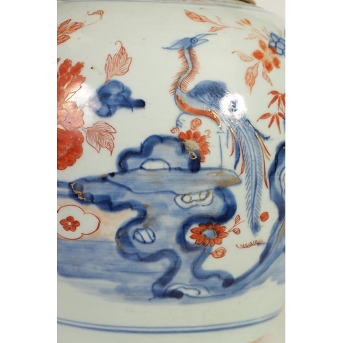 270 - A 18TH CENTURY CHINESE IMARI GINGER JAR AND COVER decorated with an exotic bird amongst blossoming b... 