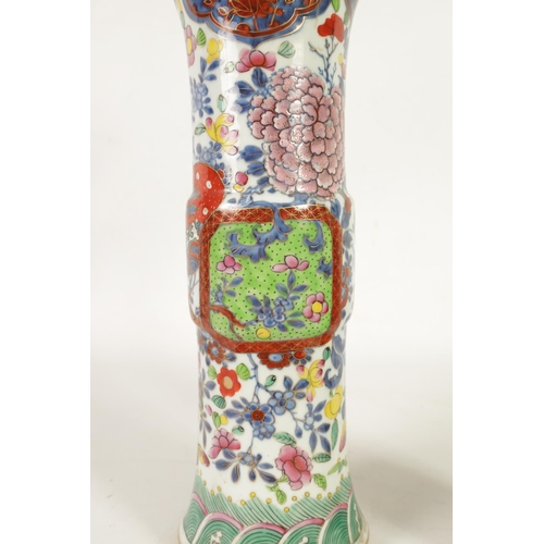 271 - A 19TH CENTURY CHINESE PORCELAIN FAMILLE ROSE CYLINDRICAL VASE with flared neck and decorated in bri... 