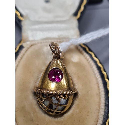 274 - A LATE 19TH CENTURY FABERGE 14CT GOLD ENAMEL AND RUBY PENDANT EGG, WORKMASTER HENRIK WIGSTROM the eg... 