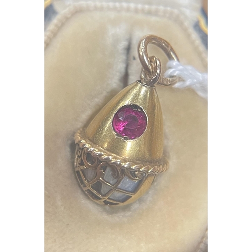 274 - A LATE 19TH CENTURY FABERGE 14CT GOLD ENAMEL AND RUBY PENDANT EGG, WORKMASTER HENRIK WIGSTROM the eg... 