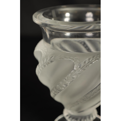 28 - A PAIR OF LALIQUE FROSTED AND CLEAR GLASS “ERMENONVILLE” VASES of twisted design on circular feet, e... 