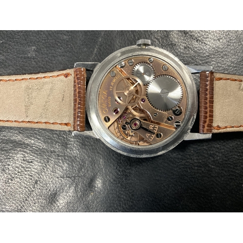 294 - A GENTLEMAN’S VINTAGE STEAL JUMBO OMEGA WRISTWATCH on snakeskin strap with Omega buckle, the silvere... 