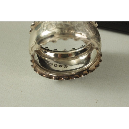 298 - A CASED SET OF SIX VICTORIAN SILVER SERVIETTE RINGS with engraved foliated bands within crimped bord... 