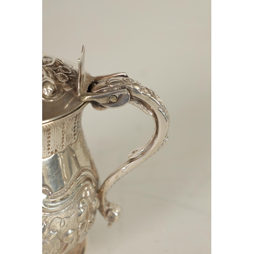 301 - A GEORGE IV SILVER MUSTARD POT AND LINER OF LARGE SIZE of lidded baluster form with embossed scroll ... 