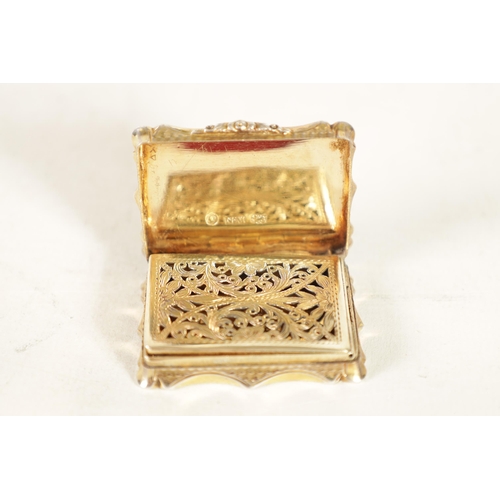 302 - AN EARLY VICTORIAN SILVER GILT VINAIGRETTE BY NATHANIEL MILLS of shaped rectangular form with engine... 