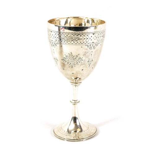 303 - A VICTORIAN SILVER CUP of pedestal form with collared bead-edged stem on a spreading foot, the bowl ... 