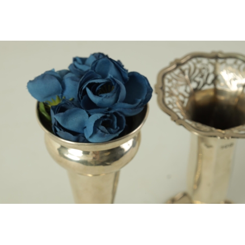 304 - A LATE VICTORIAN SILVER ROSE VASE AND ANOTHER of shaped footed tapering panelled form with everted p... 