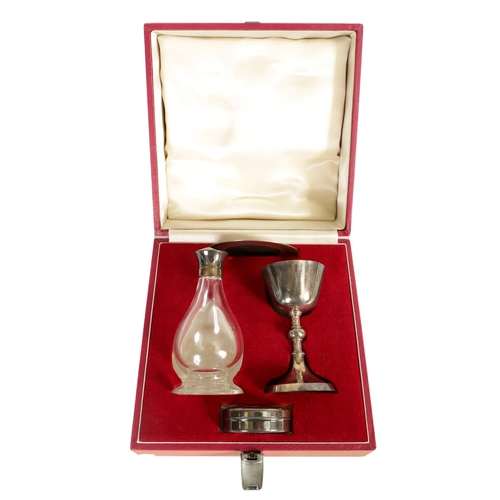 308 - A CASED SILVER COMMUNION SET Consisting of a chalice, paten, a pyx box with gilt interior and a deca... 