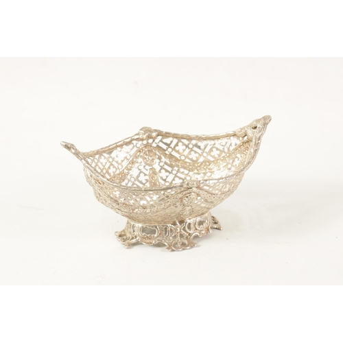 311 - A VICTORIAN HEAVY GAUGE OVAL SILVER BASKET of boat shape with raised leafwork side handles above a q... 