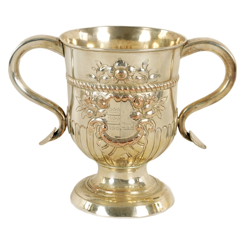 312 - A LATE GEORGIAN OLD SHEFFIELD PLATE TWO-HANDLED TROPHY CUP with half fluted body, engraved armorial ... 