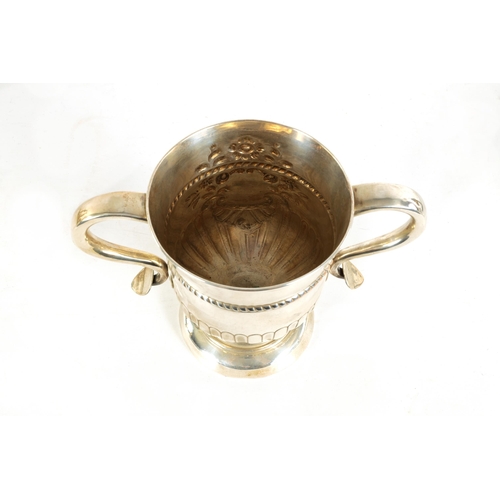 312 - A LATE GEORGIAN OLD SHEFFIELD PLATE TWO-HANDLED TROPHY CUP with half fluted body, engraved armorial ... 