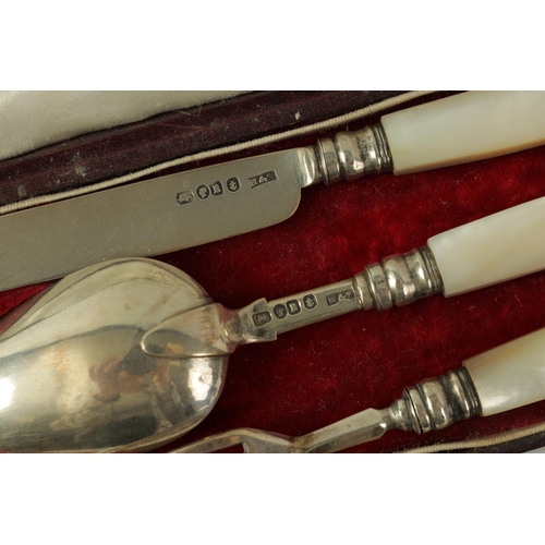 313 - A VICTORIAN 3 PIECE CASED SET OF SILVER CHILD'S CUTLERY comprising knife, fork and spoon with scroll... 