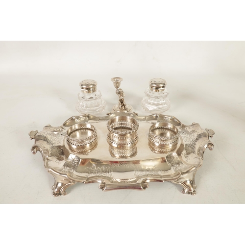 315 - A STYLISH VICTORIAN LARGE SILVER DESK STAND of shaped oval double scroll handled form with engraved ... 