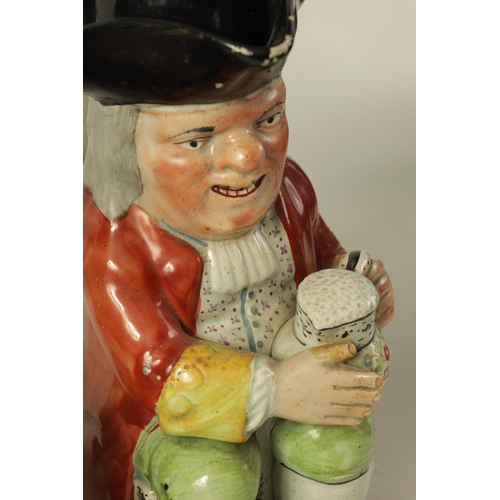 32 - TWO LATE 18TH/EARLY 19TH CENTURY RALPH WOOD TYPE STAFFORDSHIRE TOBY JUGS both seated portly gentleme... 