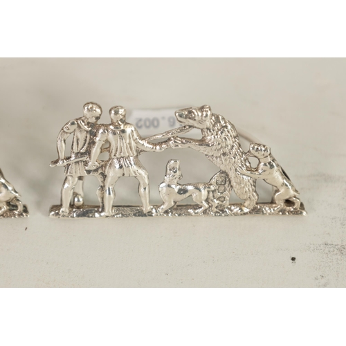 323 - TWO PAIRS OF LATE VICTORIAN SILVER MENU HOLDERS of cast open work bear and lion hunting designs on h... 