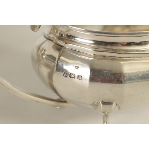 327 - A GEORGE V THREE-PIECE SILVER TEA SERVICE of oblate panelled form raised on splay feet; comprising t... 