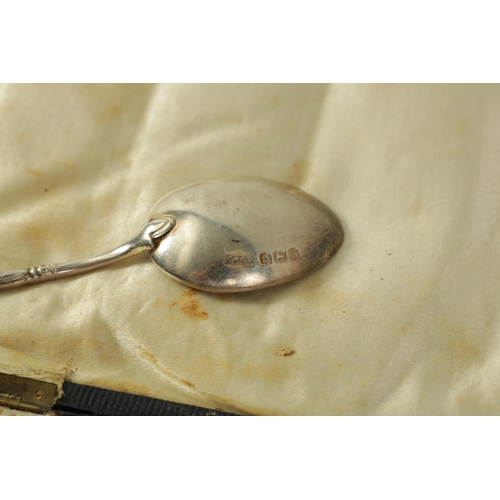 329 - A CASED SET OF 6 EDWARD VII SILVER AND ENAMEL TEASPOONS with cast openwork floral tops and leafwork ... 