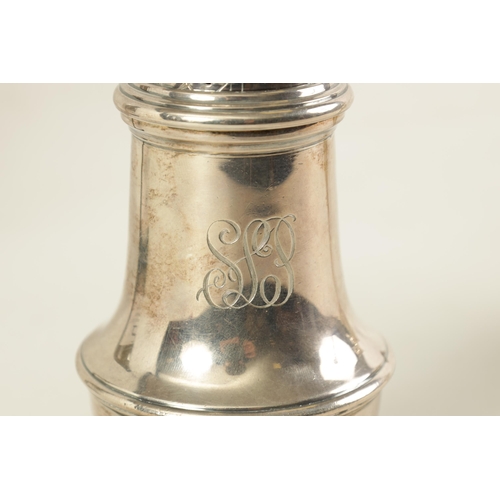 335 - A LARGE 20TH CENTURY SILVER SUGAR SHAKER of plain pedestal baluster form with pierced panelled cover... 